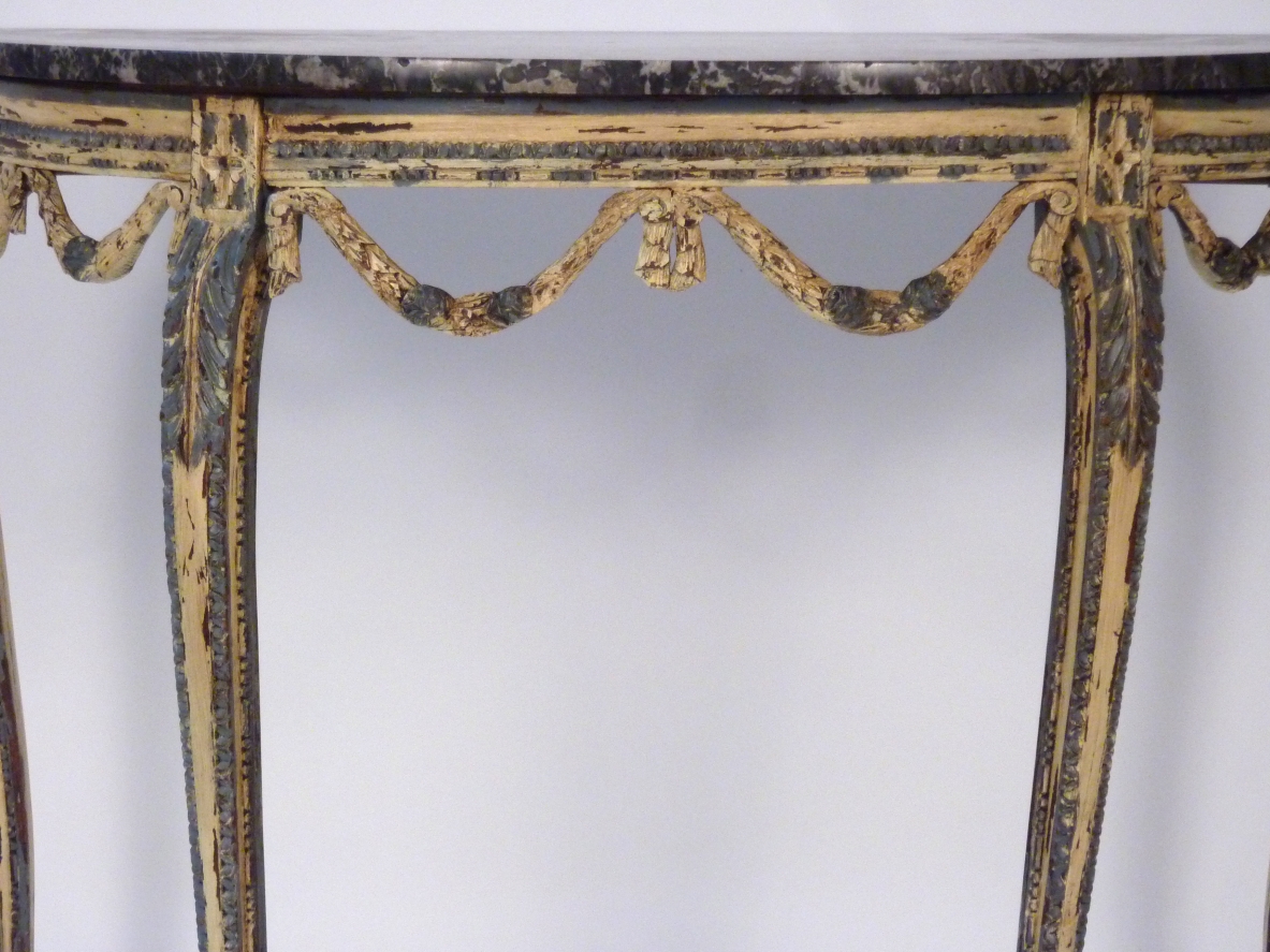 Luis XVI console table in painted thin carved wood, France 1770's.