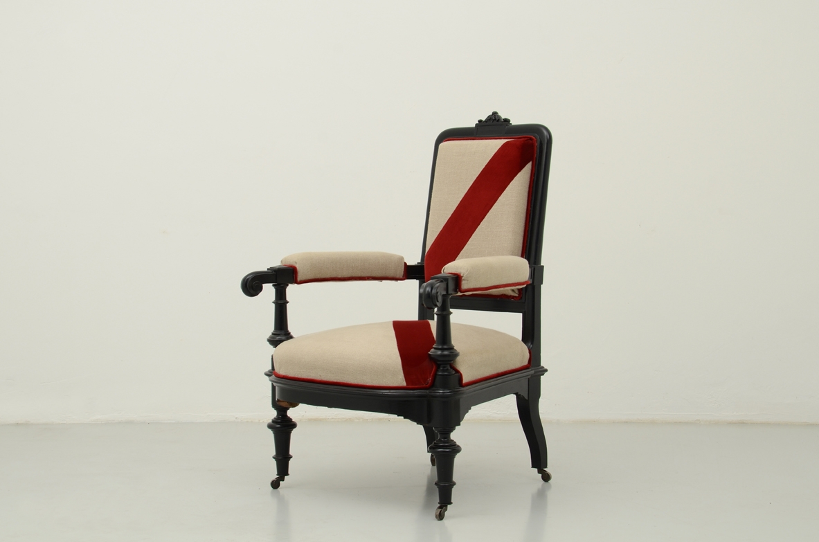 Beautiful 1880's Italian ebonized armchair with linen and velvet upholstery.