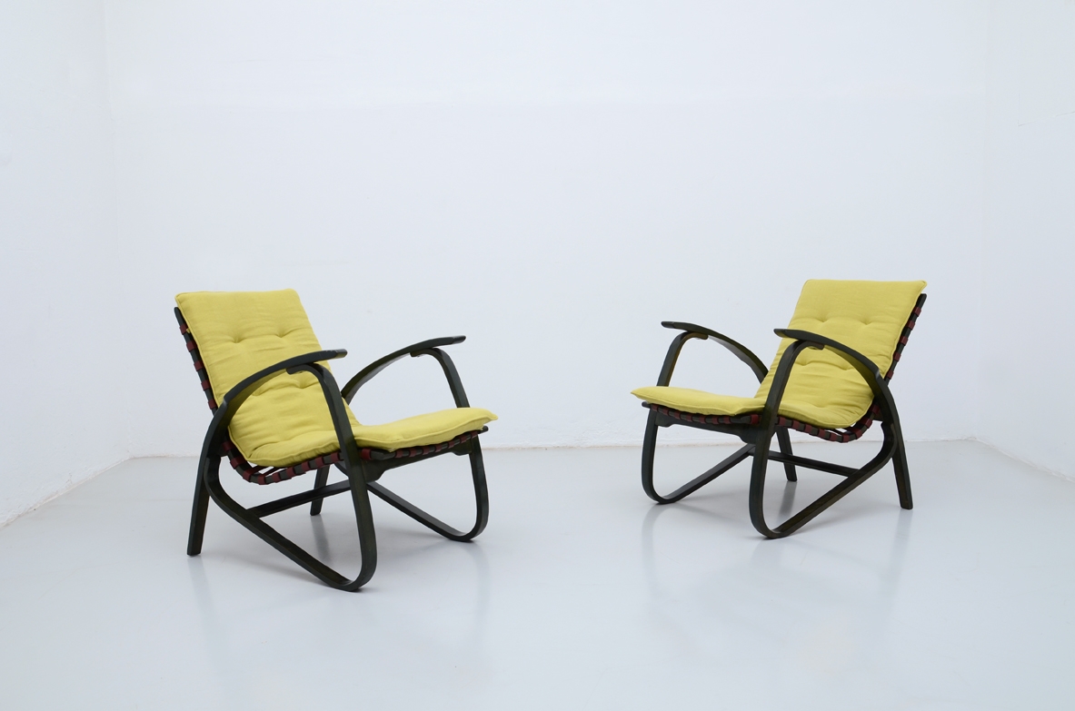 Jan Vanek, stunning pair of easy chairs in bent wood, polished with their original dark green color, Prague 1935.