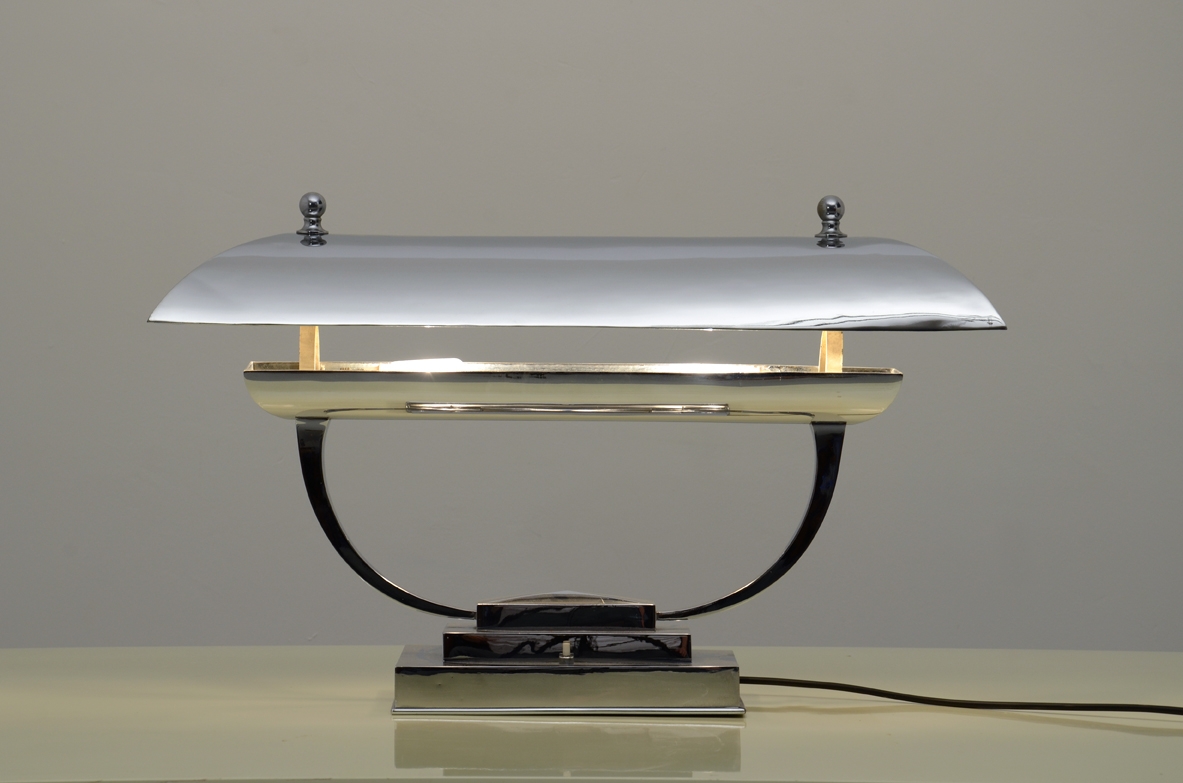 Italian 1940's table lamp in chromium plate with adjustable top.