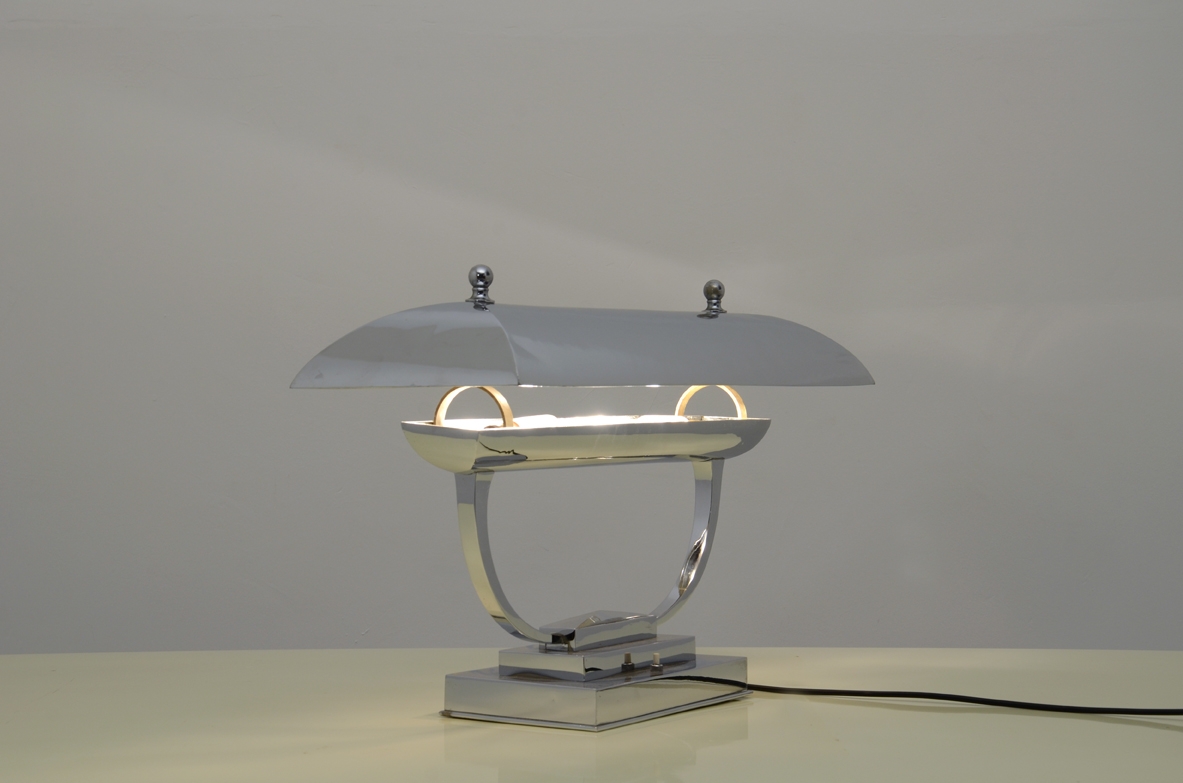 Italian 1940's table lamp in chromium plate with adjustable top.