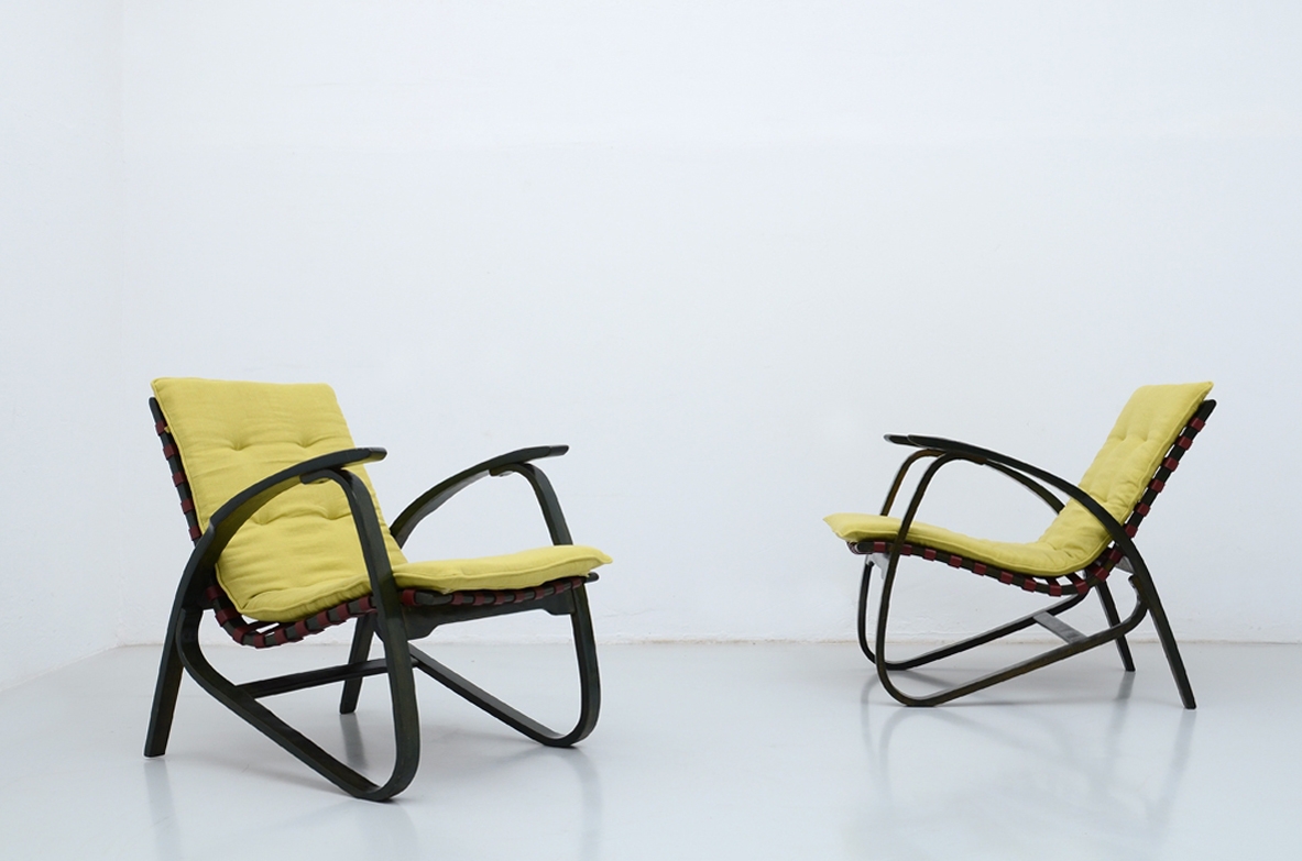 Jan Vanek, stunning pair of dynamic easy chairs in bentwood, polished with their original dark green color, Prague 1935.