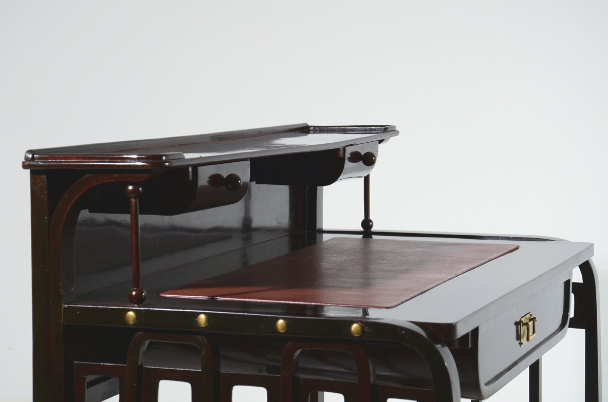 Josef Hoffman, rare desk designed in 1905 ca. and manufactured by J.& J. Khon, Vienna. Beech stained to simulate mahogany, top with a dark red leather, brass handle and details. Lit.: Kohn factory catalogue, 1906, p. 58.  