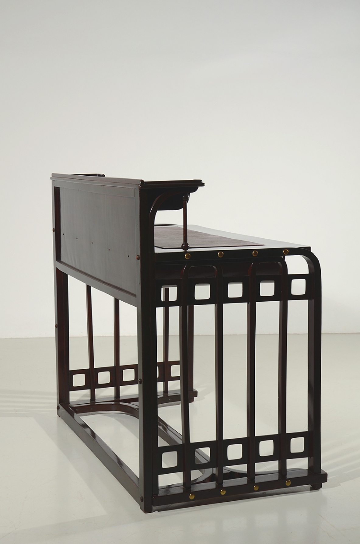 Josef Hoffman, rare desk designed in 1905 ca. and manufactured by J.& J. Khon, Vienna. Beech stained to simulate mahogany, top with a dark red leather, brass handle and details. Lit.: Kohn factory catalogue, 1906, p. 58.  