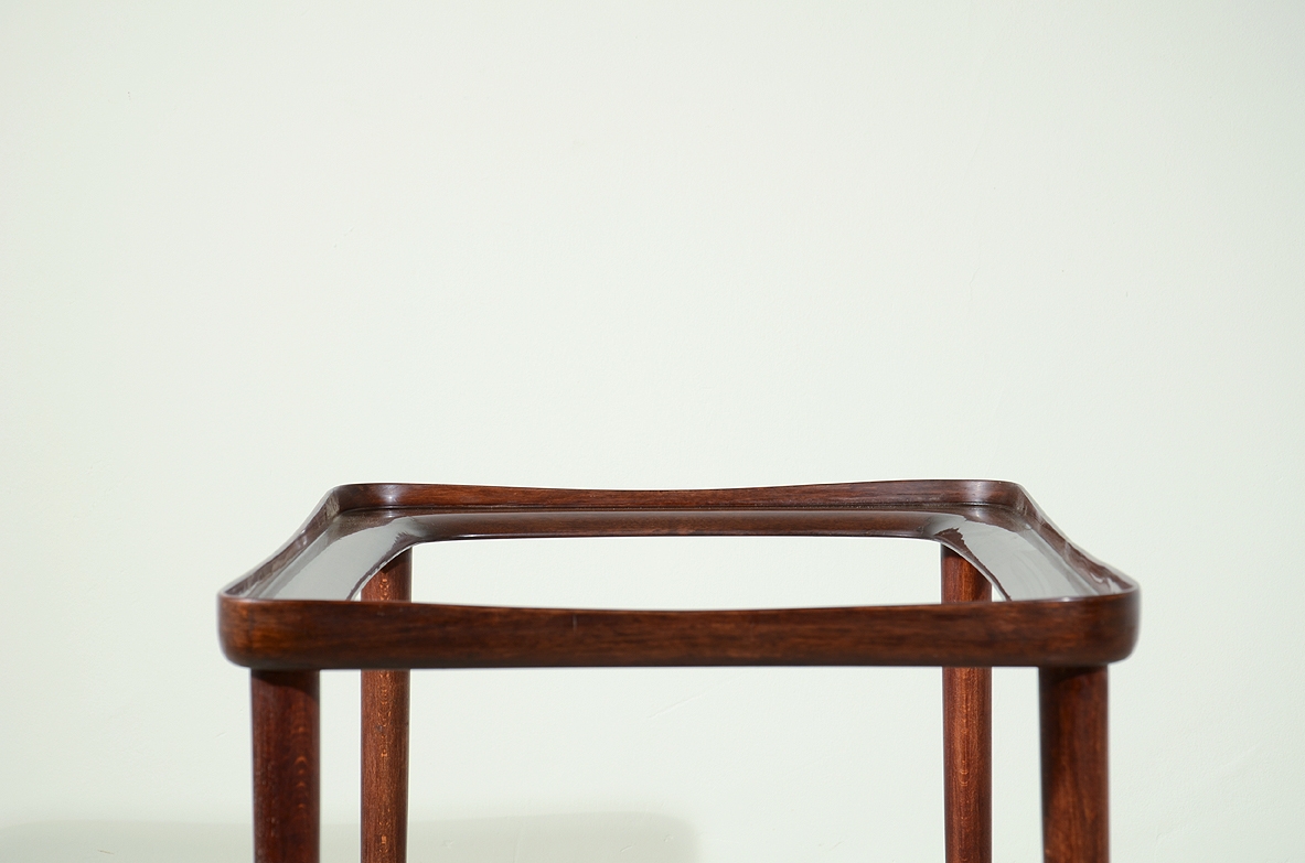 Ico Parisi, 1950's coffee table in mahogany with brass details and glass top.