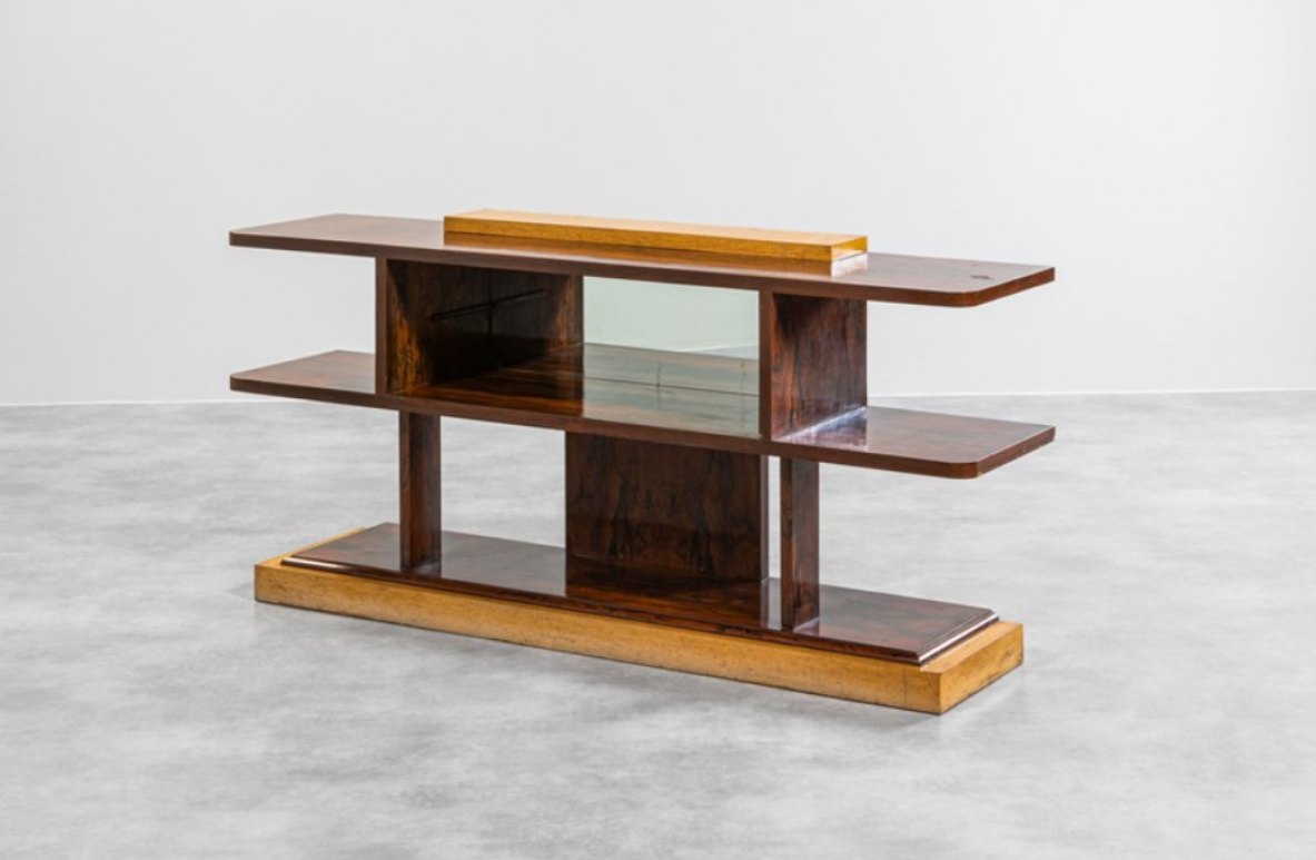 Elegant Art Deco console table in wood and goat skin with shelves and a silvered crystal glass. Italy 1940's.