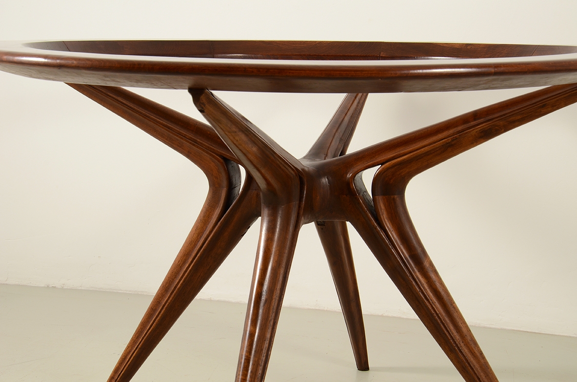 Gianni Vigorelli round table in wood and thick glass, 1950s.