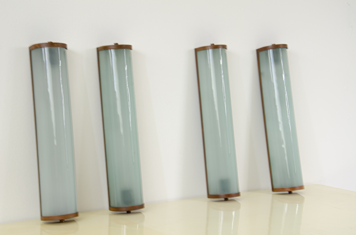 Four large wall lights in glass and brass, 1940s.