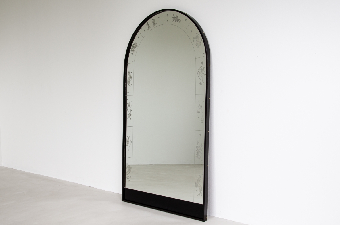 Mirror with engravings depicting the signs of the zodiac.  Mirrored crystal with stained wood frame.  Italy, 1940's.