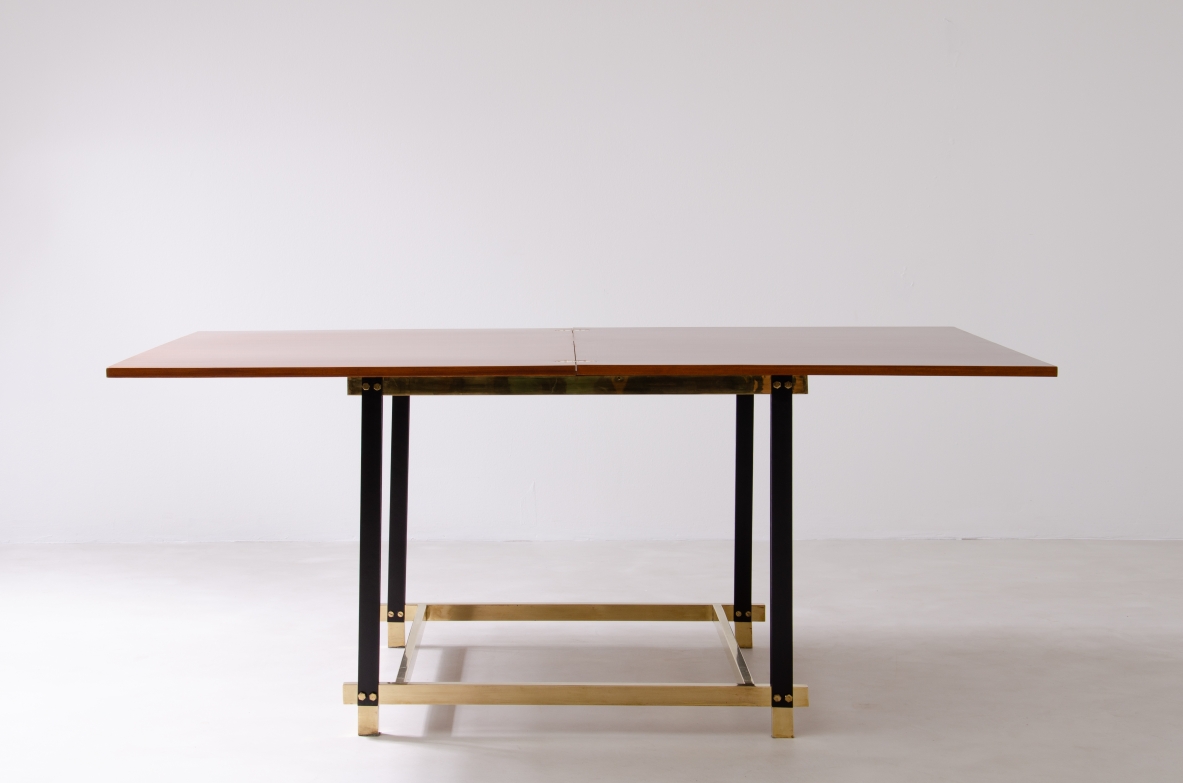 1960s extendable mahogany table with metal and brass structure.