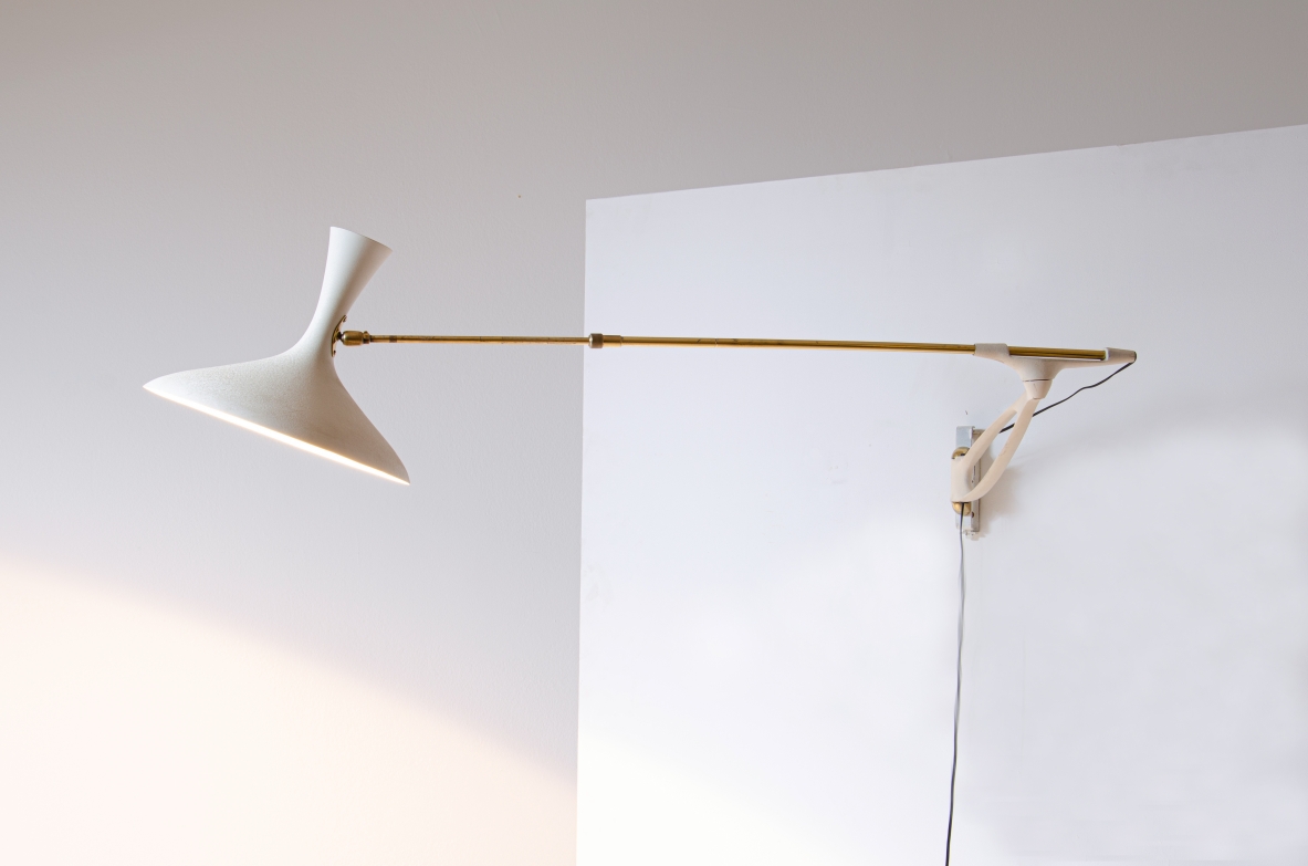 Wall lamp with adjustable arm and extendable stick.  Painted metal and brass, France 1950s.