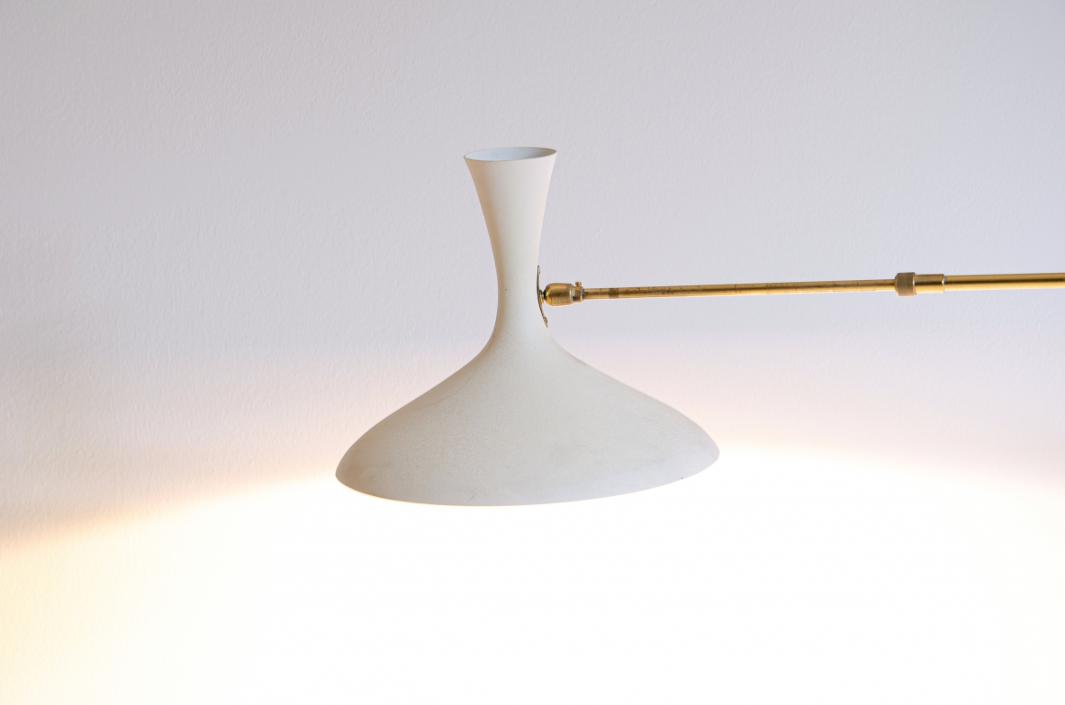 Wall lamp with adjustable arm and extendable stick.  Painted metal and brass, France 1950s.