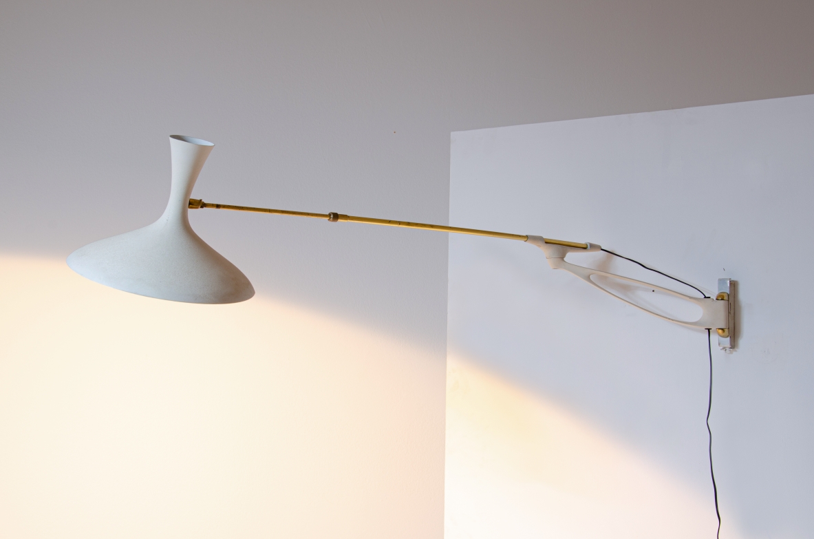 Wall lamp with adjustable arm and extendable stick.  Painted metal and brass, France 1950s.