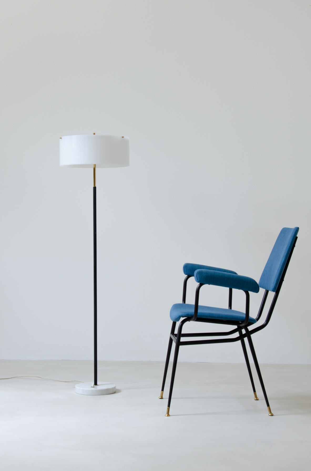 Armchair with iron structure and upholstered seat, armrests and backrest. Brass tips.  Studio BBPR, 1950s.