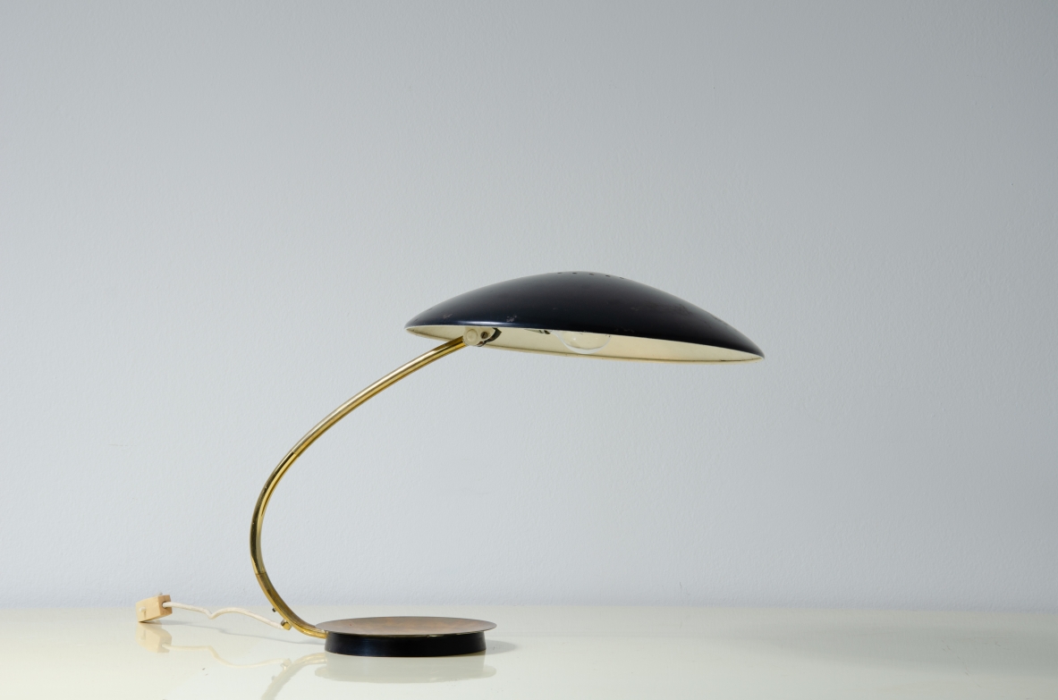 Table lamp with lacquered metal shade and brass stem.  Italy, 1950s. 