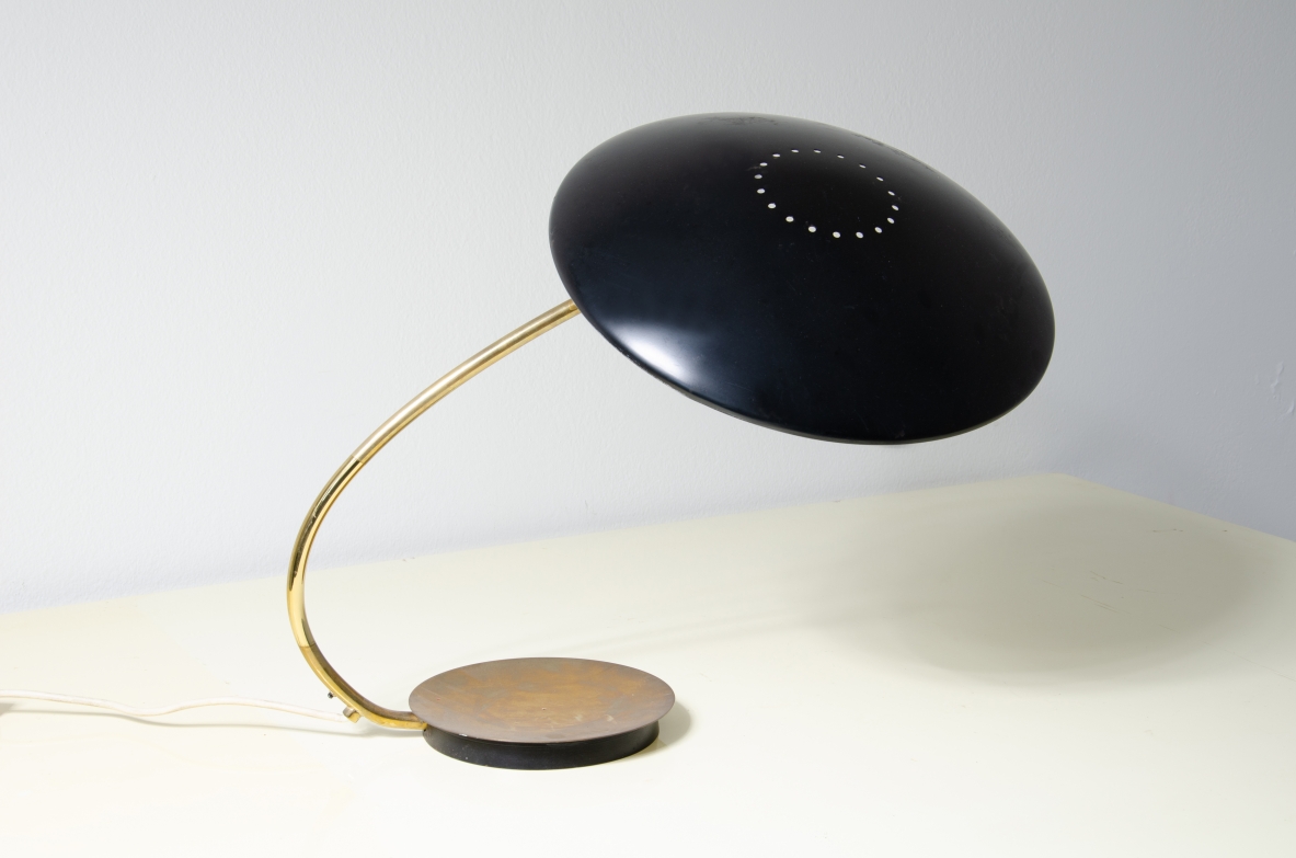 Table lamp with lacquered metal shade and brass stem.  Italy, 1950s. 
