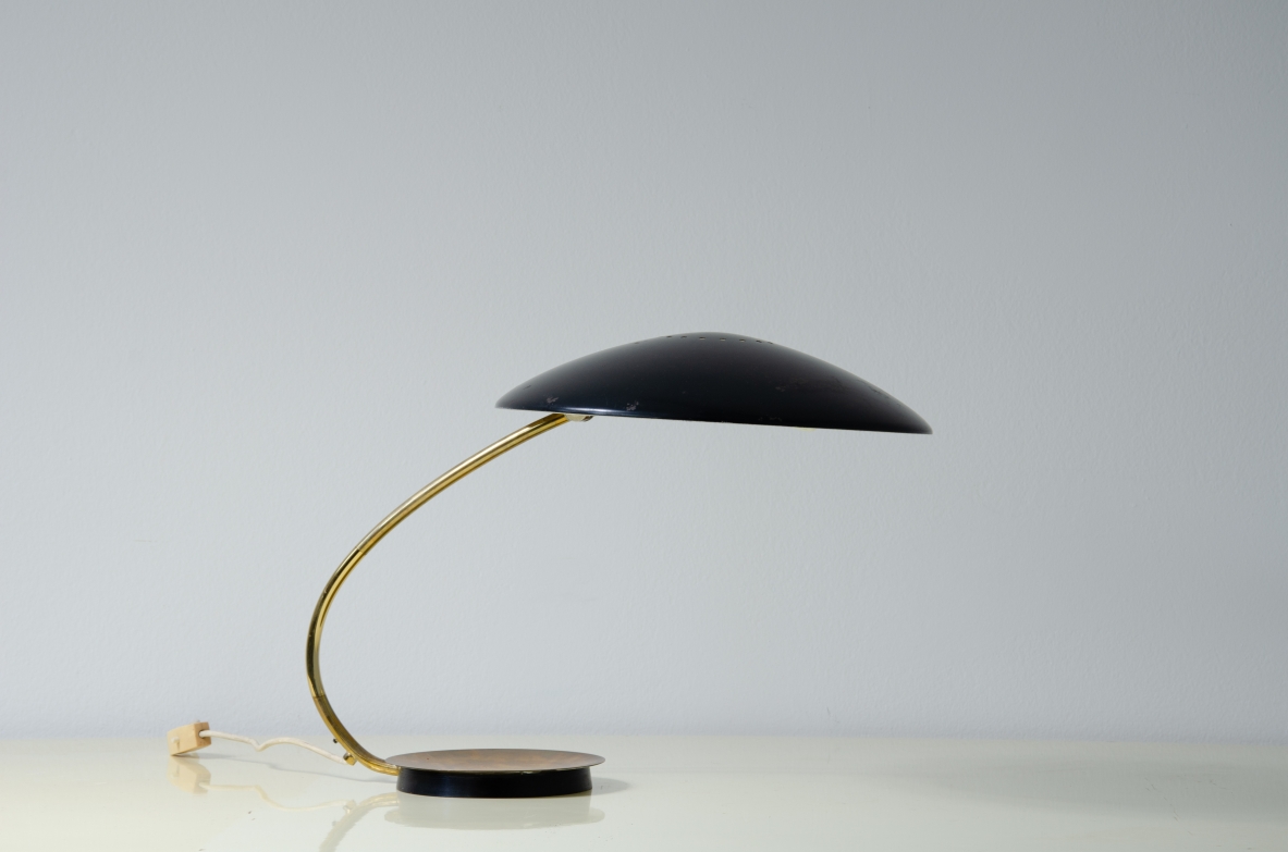 Table lamp with lacquered metal shade and brass stem.  Italy, 1950s. 