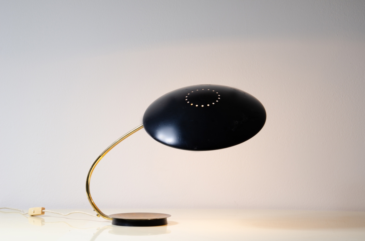 Table lamp with lacquered metal shade and brass stem.  Italy, 1950s. 