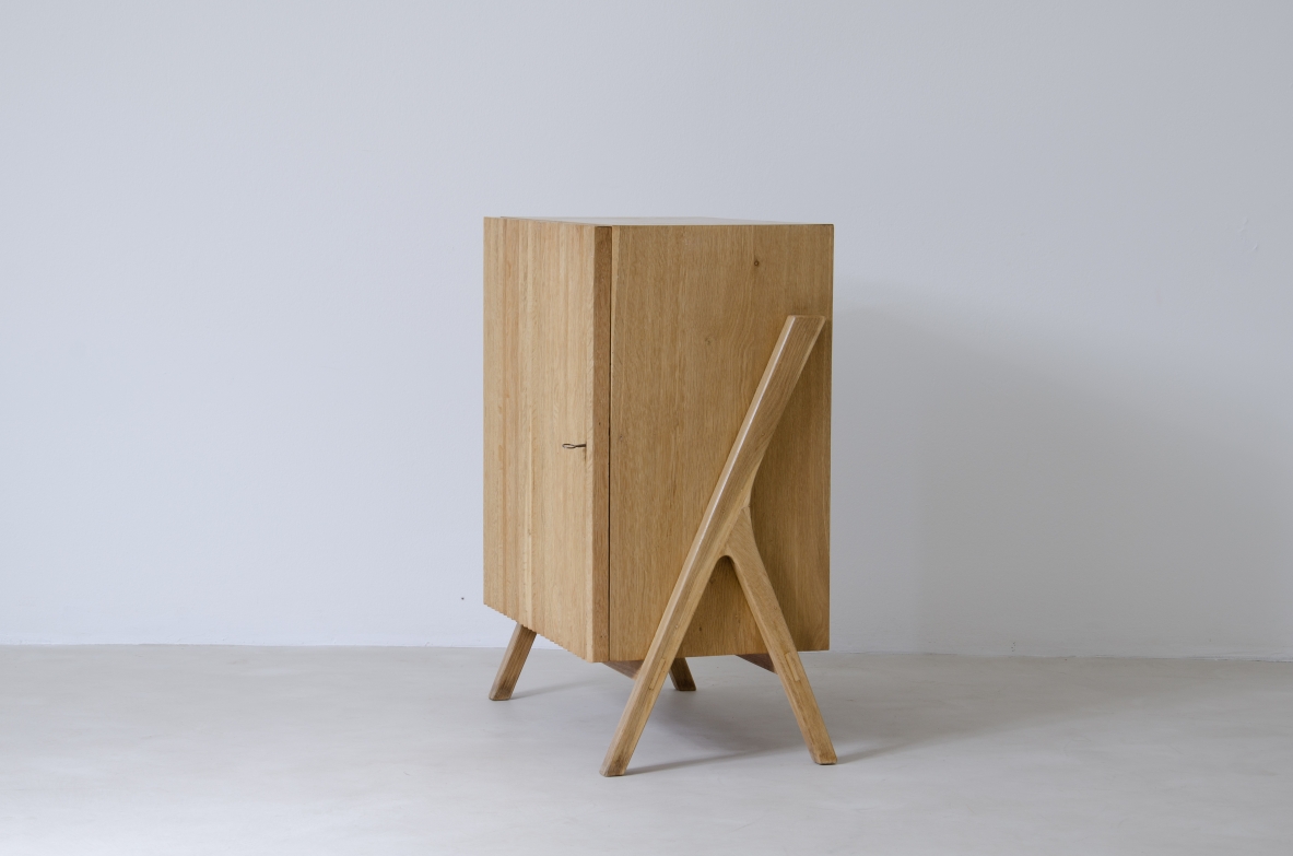 Small storage unit in light oak with ribbed wood front.  Italiy 1950s.