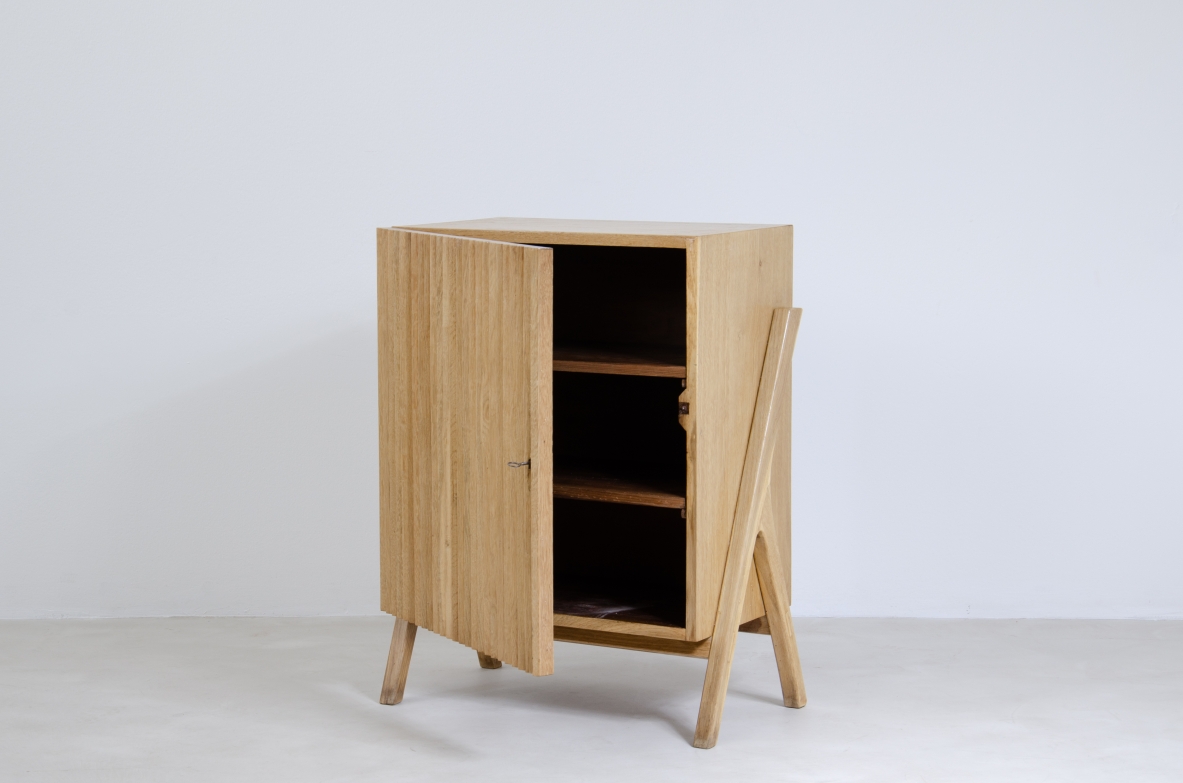 Small storage unit in light oak with ribbed wood front.  Italiy 1950s.