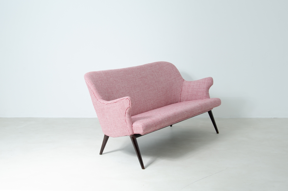 Osvaldo Borsani (1911-1985)  Sofa covered in fabric with long turned wooden feet.  Manifactured by ABV.  Borsani, Varedo, 1950s.
