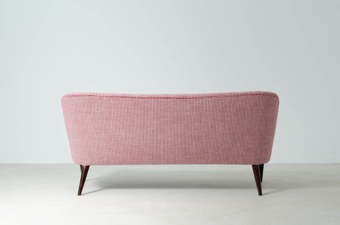 Osvaldo Borsani (1911-1985)  Sofa covered in fabric with long turned wooden feet.  Manifactured by ABV.  Borsani, Varedo, 1950s.