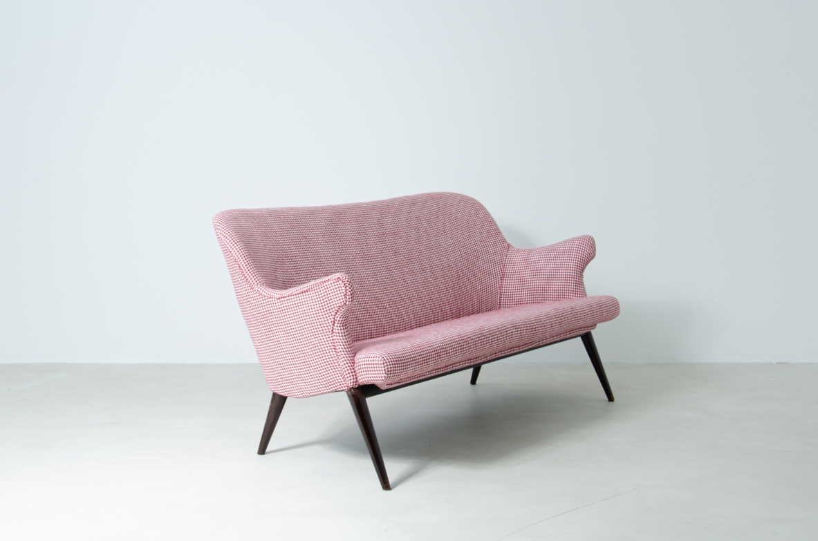 Osvaldo Borsani (1911-1985)  Sofa covered in fabric with long turned wooden feet.  Manifactured by ABV.  Borsani, Varedo, 1950s.