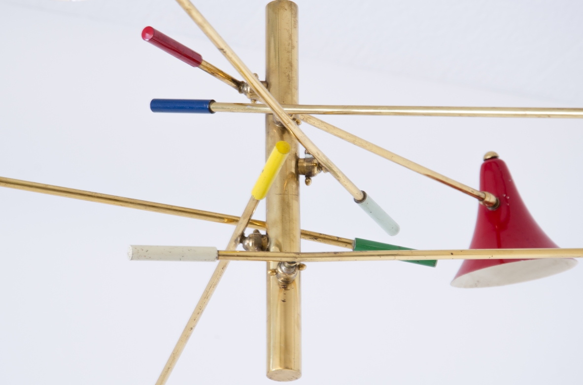 Rare suspension lamp with six adjustable brass arms and painted metal diffusers.  Italian manufacture, 1950s.