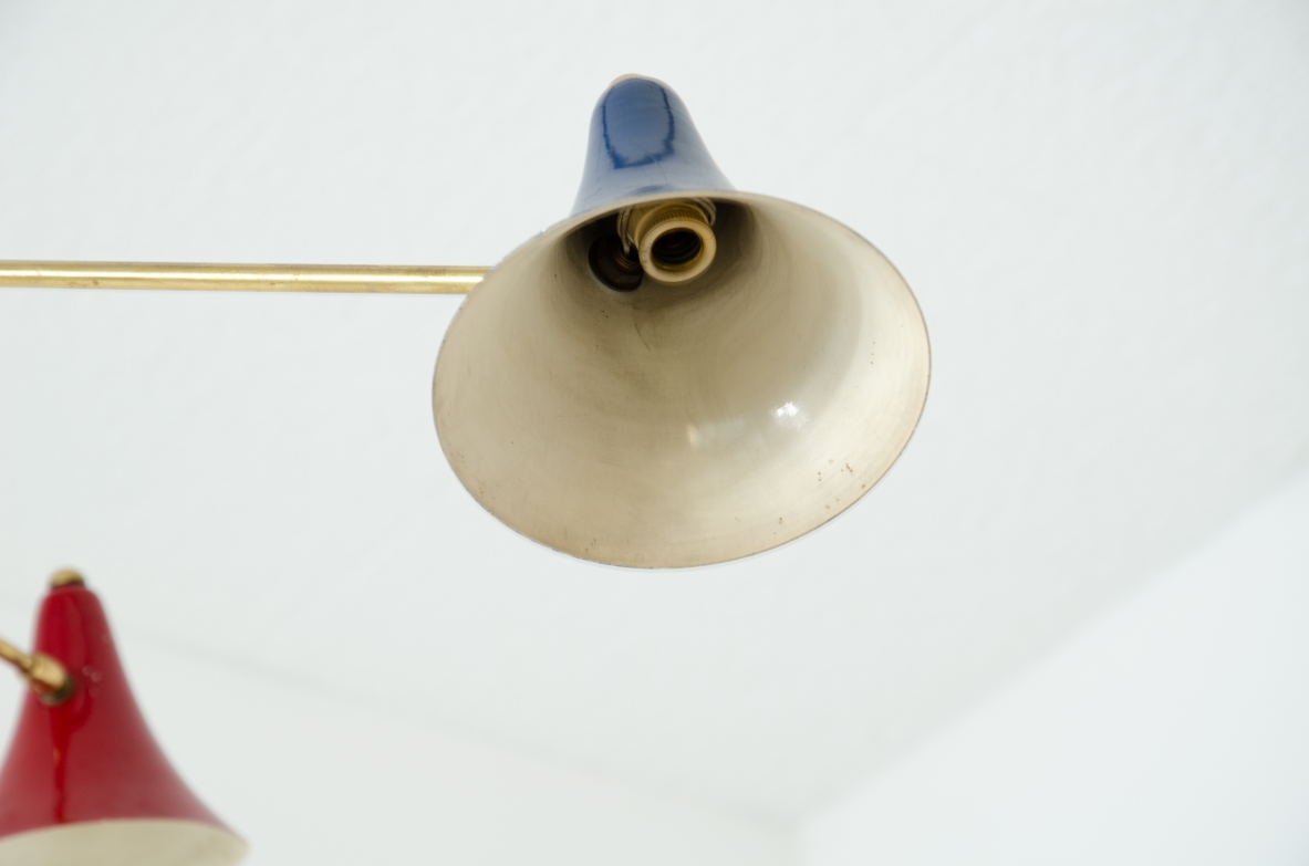 Rare suspension lamp with six adjustable brass arms and painted metal diffusers.  Italian manufacture, 1950s.