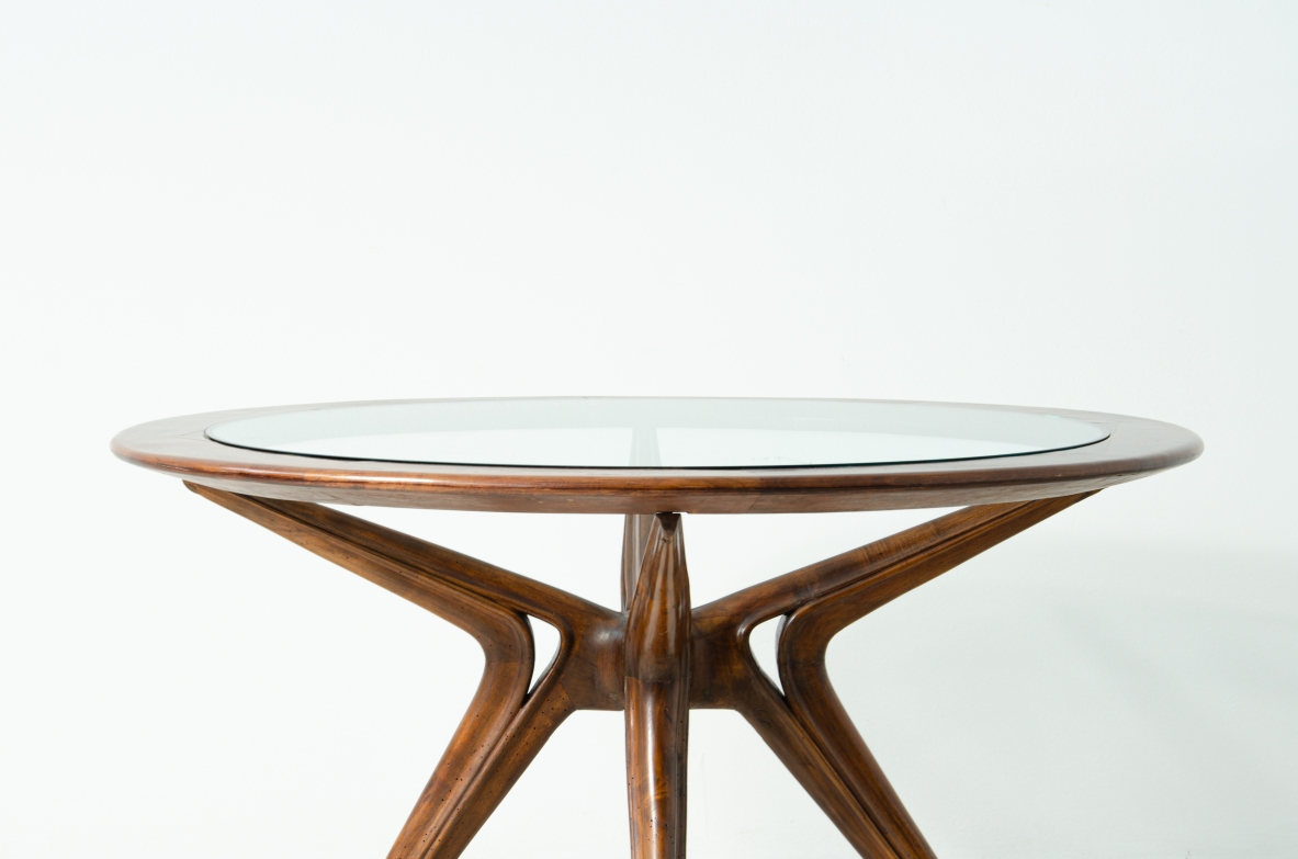 Gianni Vigorelli round table in wood and thick glass, 1950s.