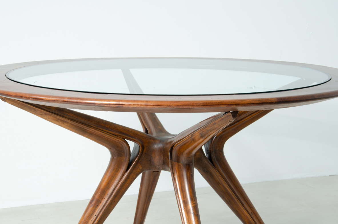 Gianni Vigorelli round table in wood and thick glass, 1950s.