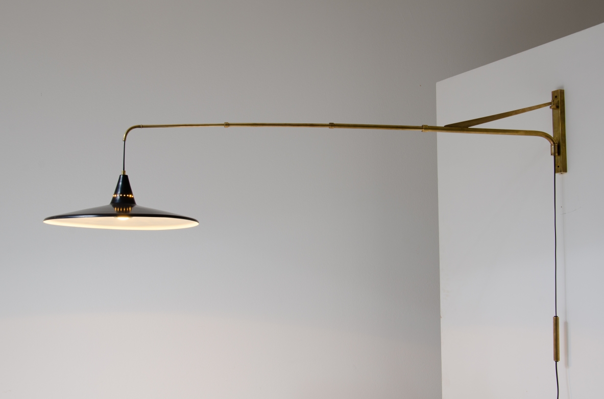 Extensible lamp with with brass stem and black painted metal shade.  Italian manufacture, 1950s.