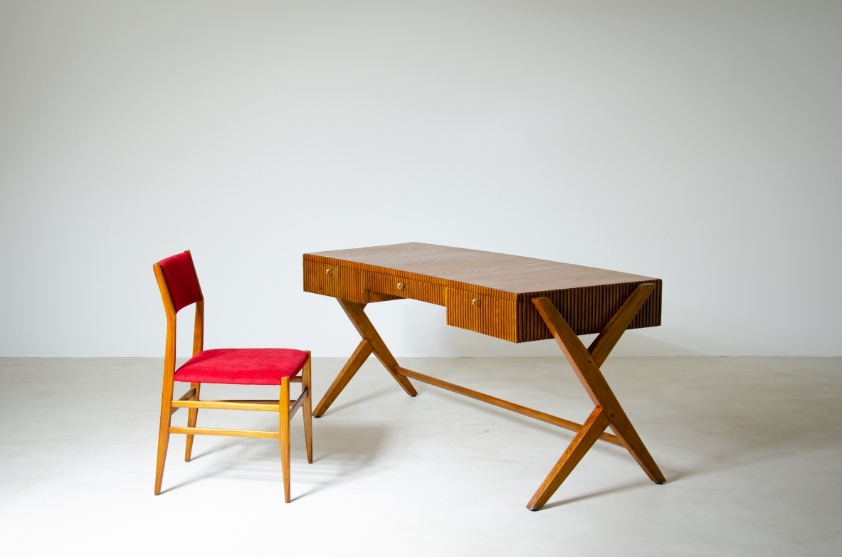 Oak desk with three drawers with ribbed wood band and curved top supported by double Y legs.  Turin School, Italy, 1950's.