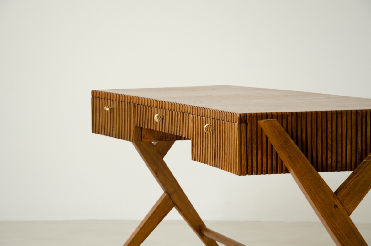 Oak desk with three drawers with ribbed wood band and curved top supported by double Y legs.  Turin School, Italy, 1950's.