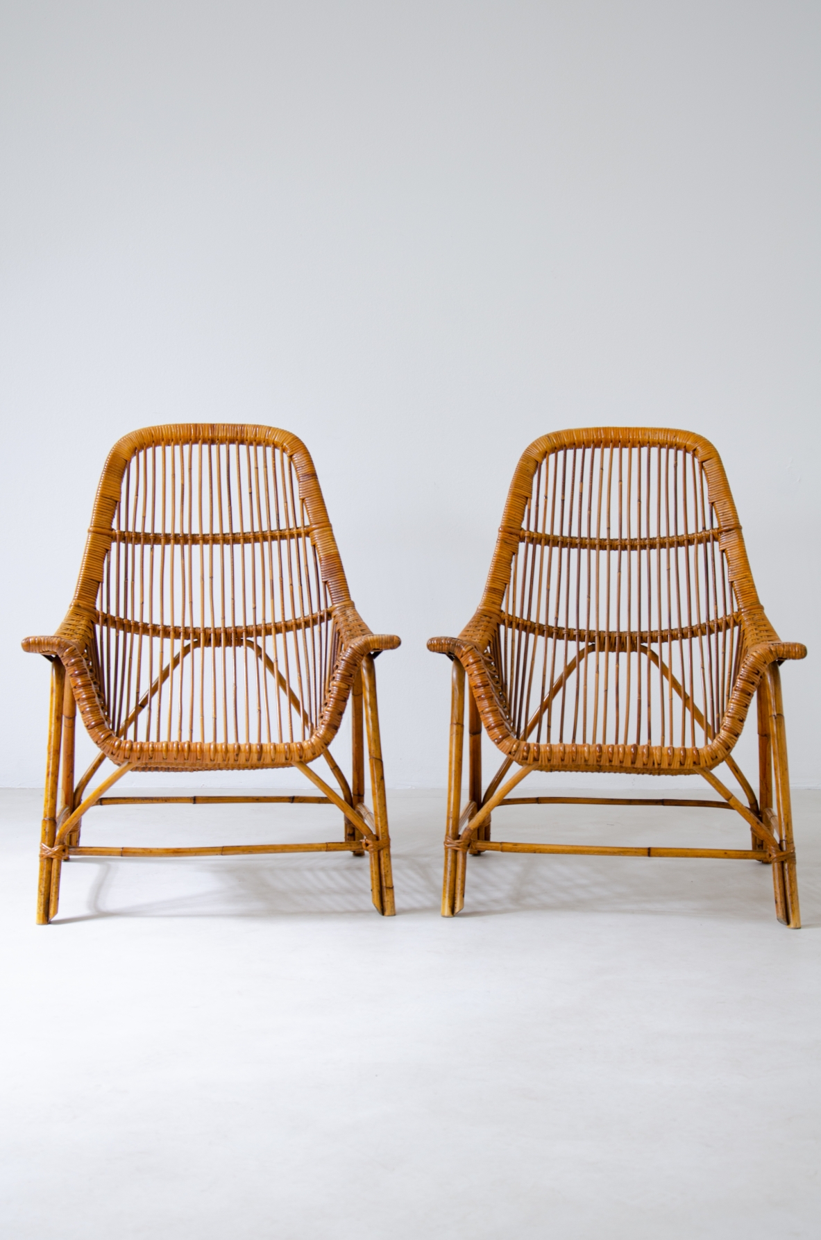 Pair of outdoor lounge chairs in wicker and bamboo.  Italian manufacture, 1950s.