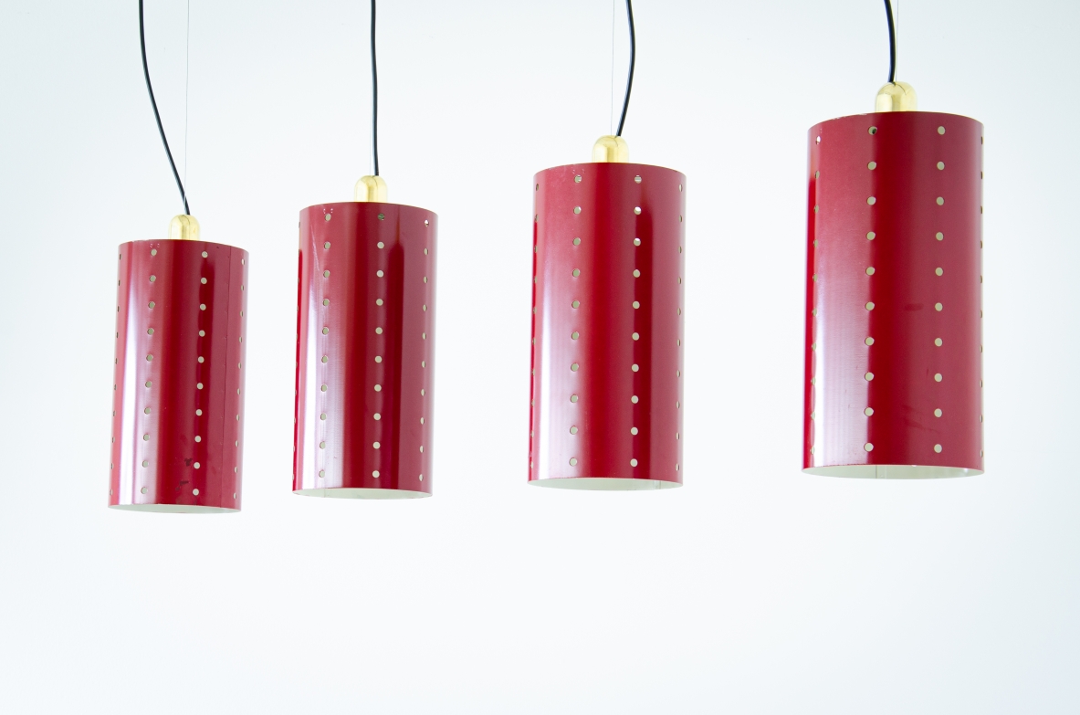 Quattro lampade a cilindro in metallo laccato e forato con bicchiere in ottone.  Manifattura italiana 1960ca.