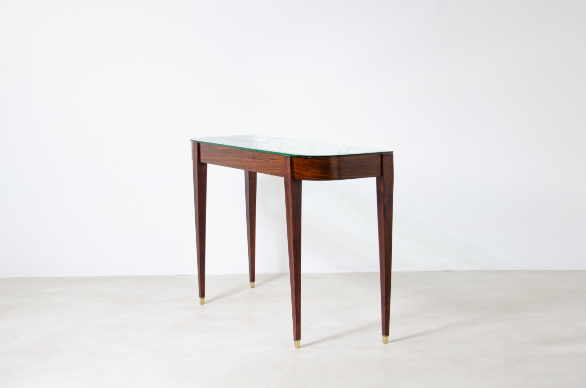 Fabrizio Clerici  Rosewood console with wrought iron front, glass top and brass tips.  Italian manufacture, 1950's.