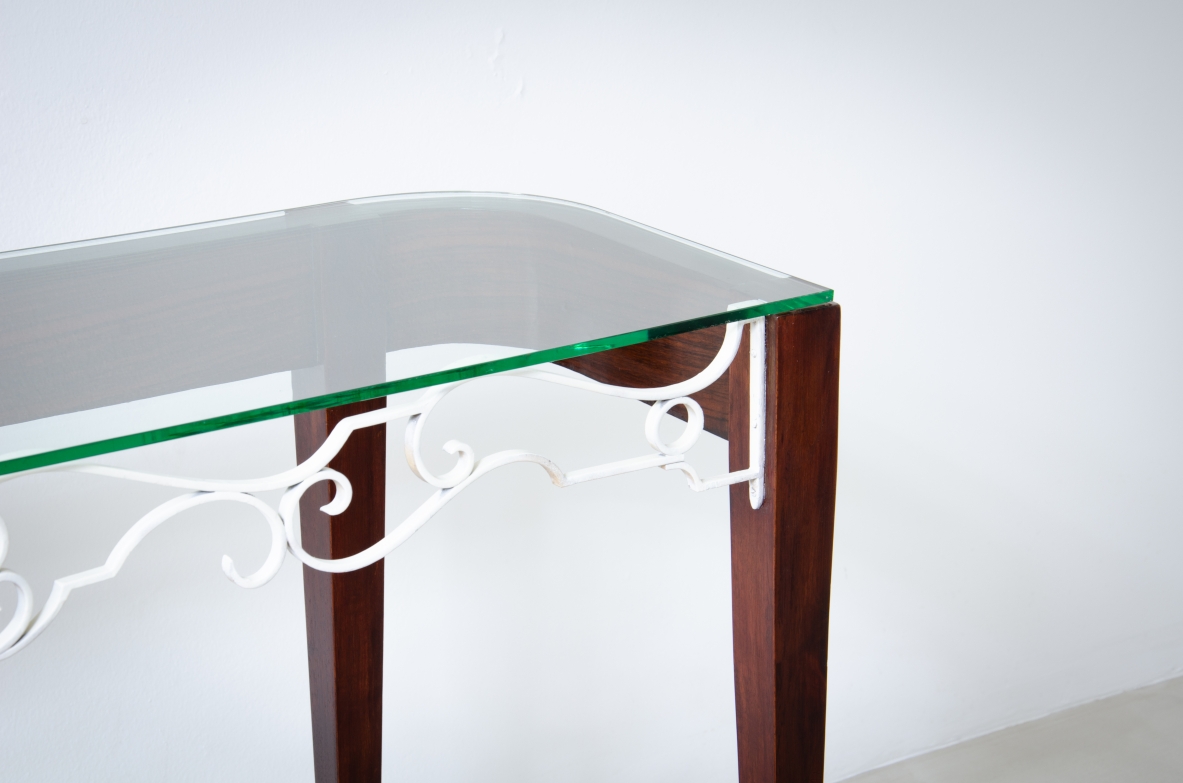 Fabrizio Clerici  Rosewood console with wrought iron front, glass top and brass tips.  Italian manufacture, 1950's.