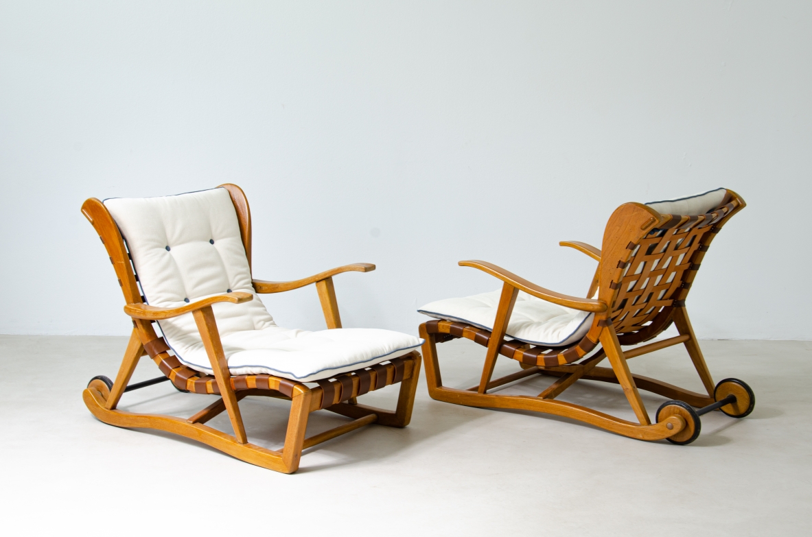 Guglielmo Pecorini. Rare pair of armchairs with rear wheels, coming from the Giulio Cesare ocean liner.