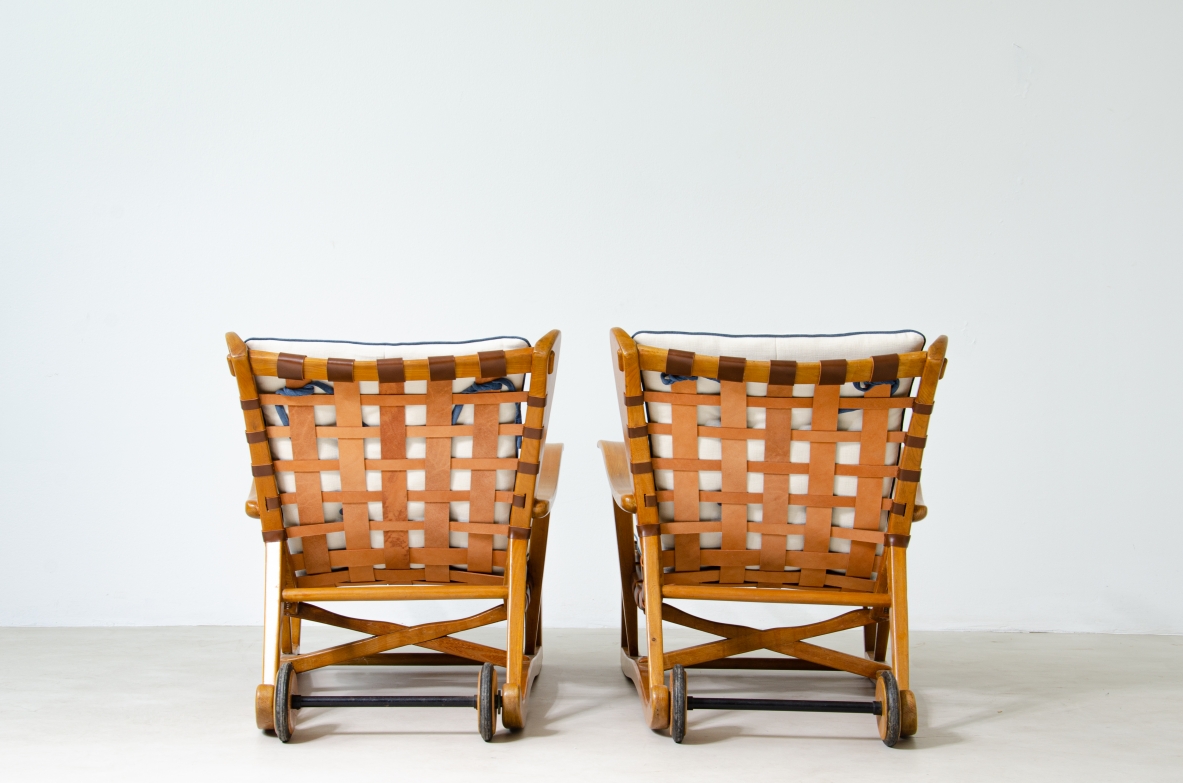 Guglielmo Pecorini. Rare pair of armchairs with rear wheels, coming from the Giulio Cesare ocean liner.