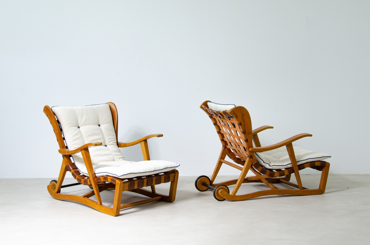 Guglielmo Pecorini. Rare pair of armchairs with rear wheels, coming from the Giulio Cesare ocean liner.