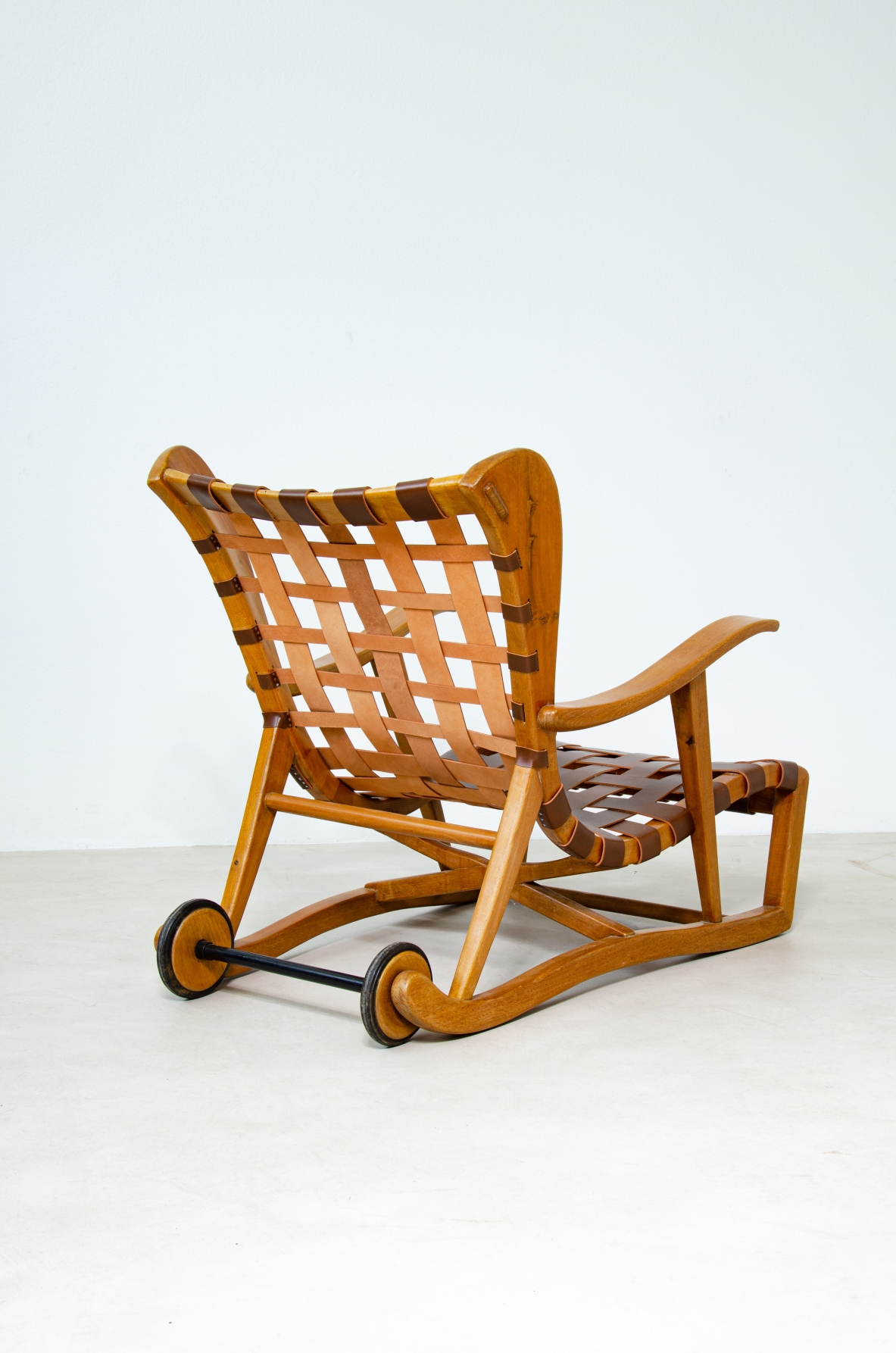 Guglielmo Pecorini. Rare pair of armchairs with rear wheels, coming from the Giulio Cesare ocean liner.
