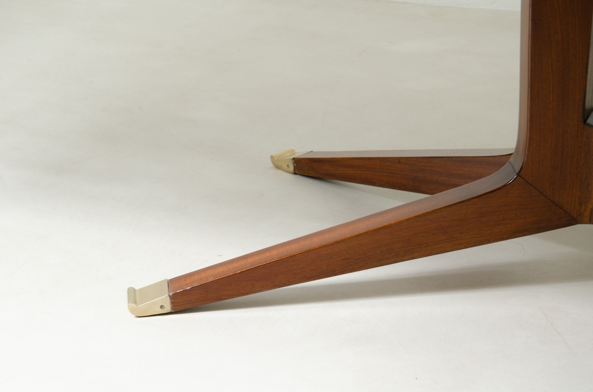 Large mahogany table with shaped top and leg with central stem and four spokes with elegant brass tip.  1950's Italian manufacture.