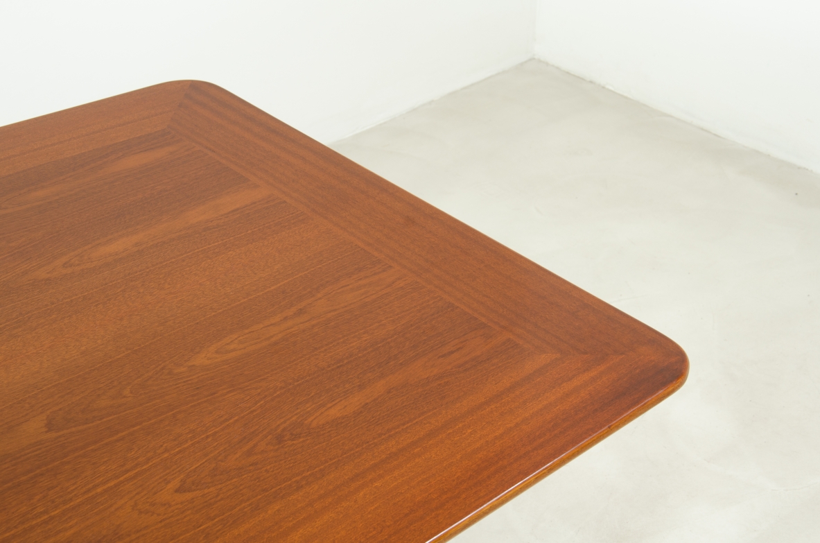 Large mahogany table with shaped top and leg with central stem and four spokes with elegant brass tip.  1950's Italian manufacture.