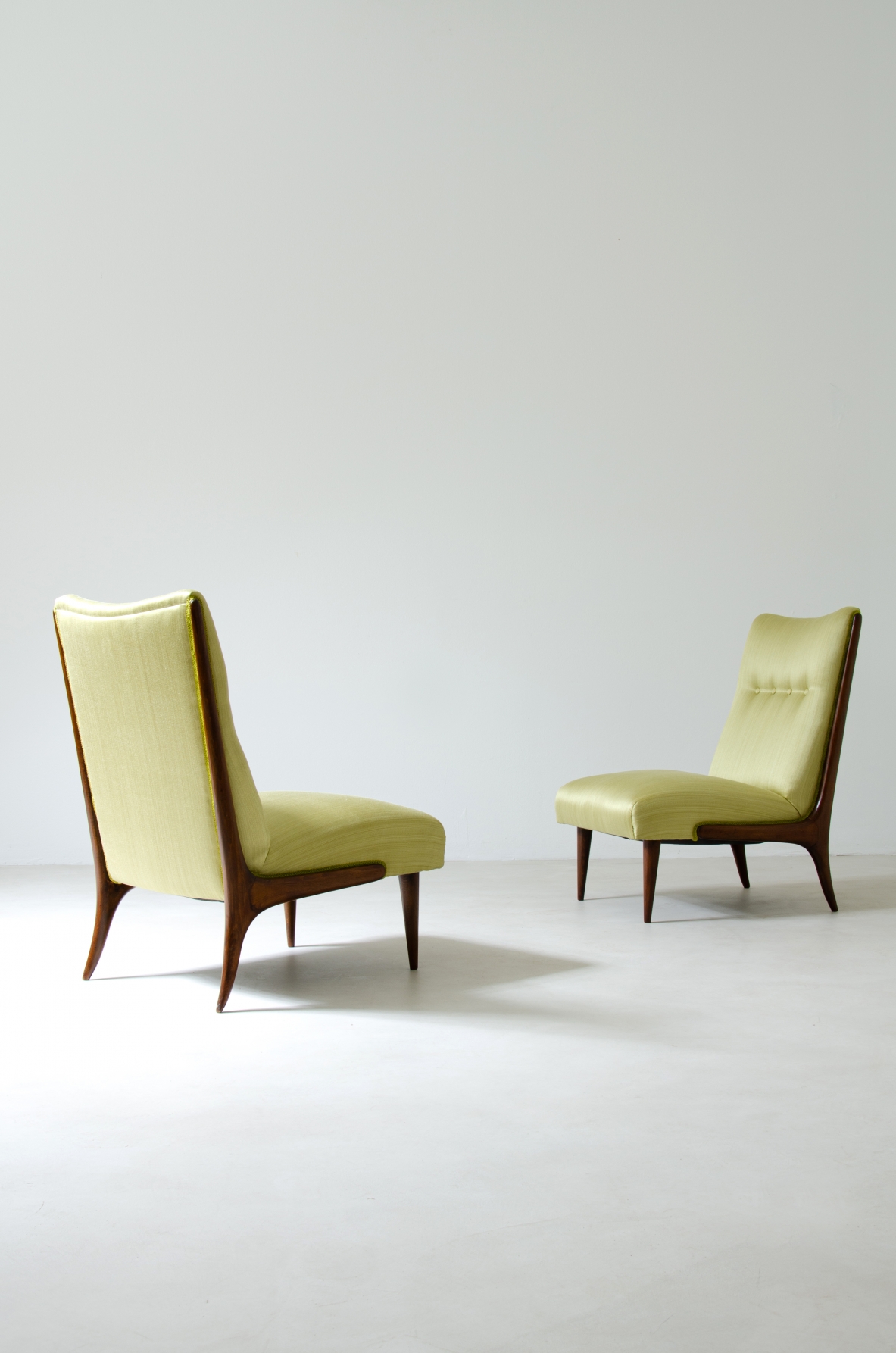 Pair of refined armchairs in polished wood with upholstered seat and back.  1950's Italian manufacture.