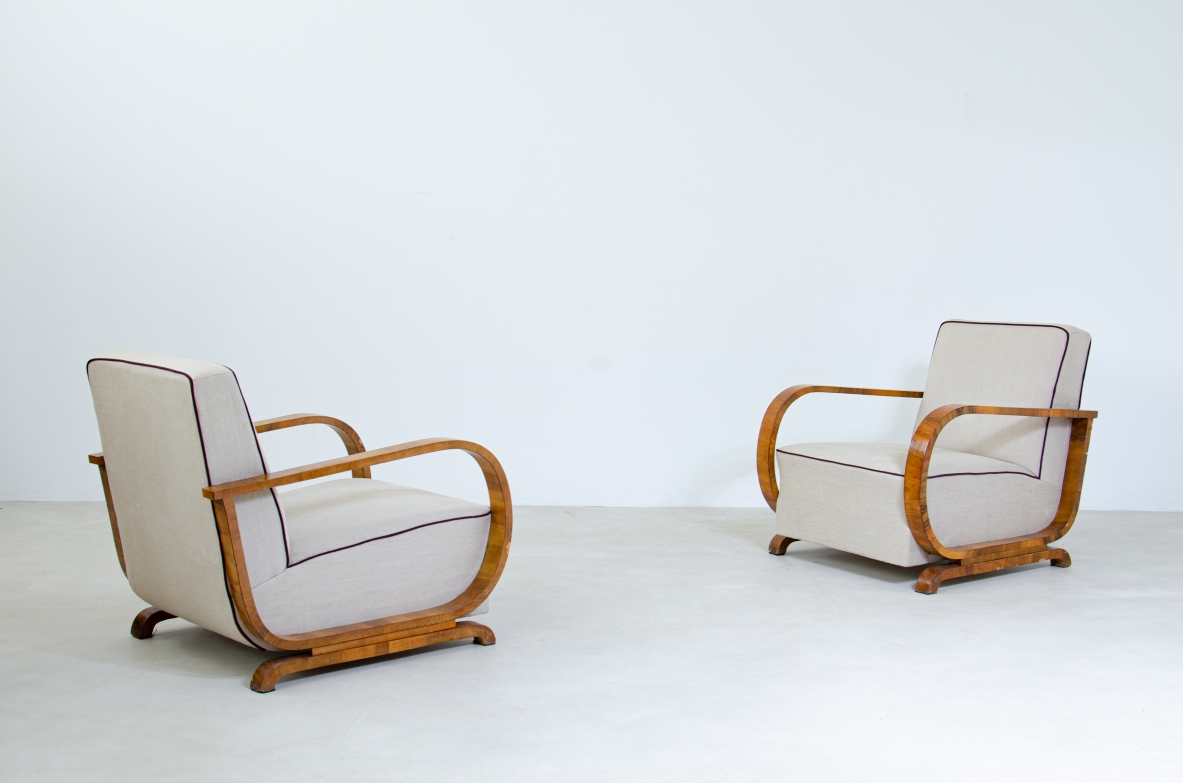 Pair of armchairs with armrests in curved wood covered in fabric.  French manufacture 1940's.