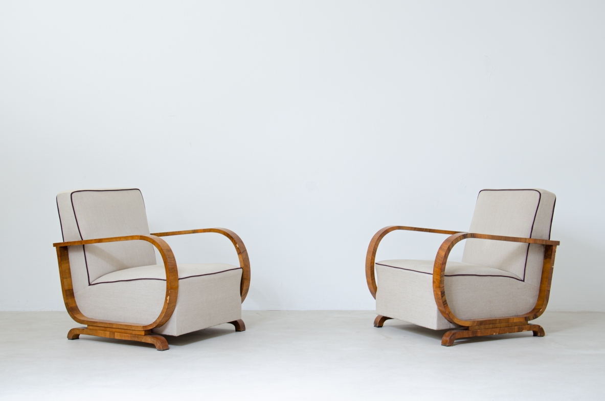 Pair of armchairs with armrests in curved wood covered in fabric.  French manufacture 1940's.