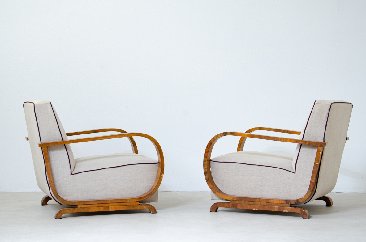 Pair of armchairs with armrests in curved wood covered in fabric.  French manufacture 1940's.