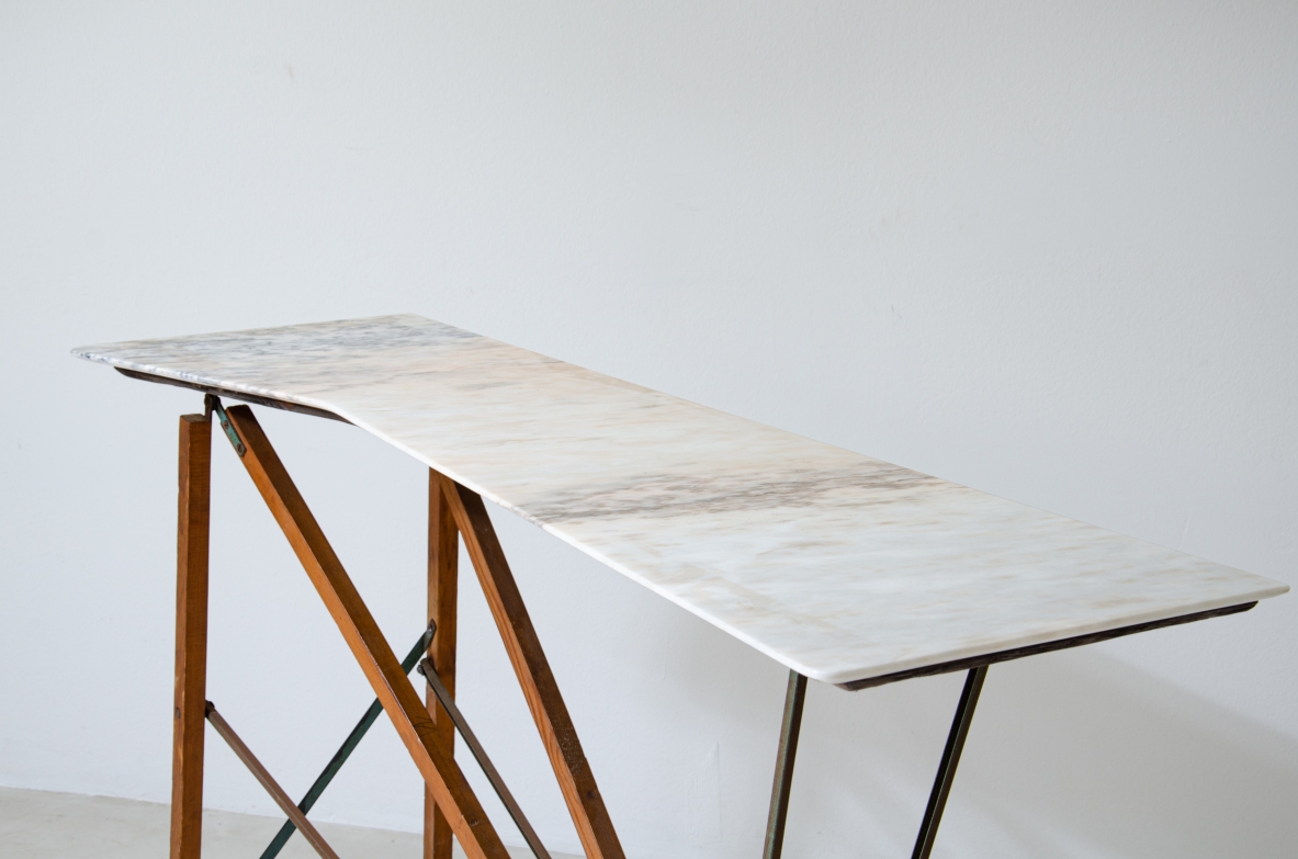 Console table with wooden structure, metal supports and irregular-shaped marble top. Italian manufacture, 1950's.