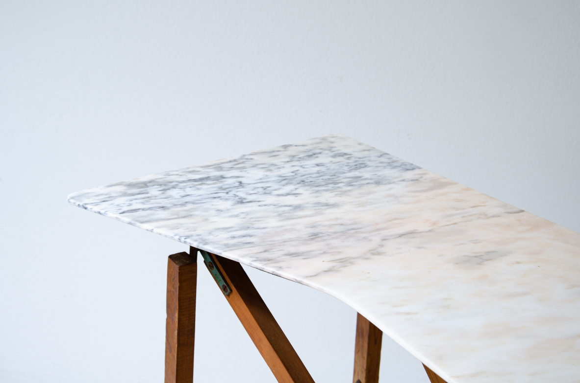 Console table with wooden structure, metal supports and irregular-shaped marble top. Italian manufacture, 1950's.